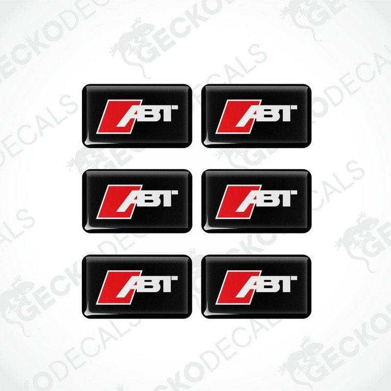A set of six square-shaped car decals with the ABT logo in red and white on a black background.