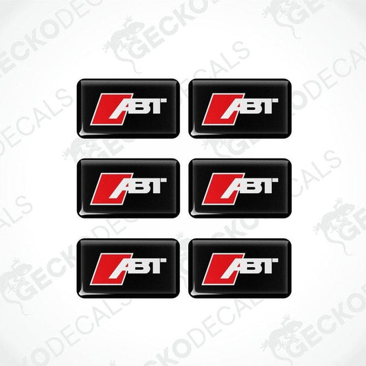 A set of six square-shaped car decals with the ABT logo in red and white on a black background.