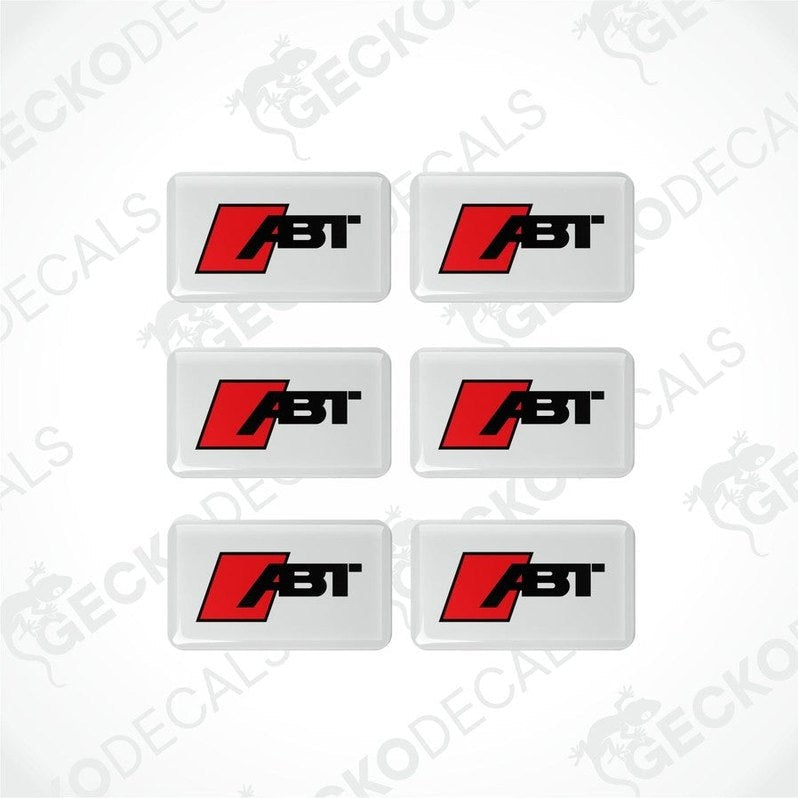 A set of six square-shaped car decals with the ABT logo in red and black on a white background.