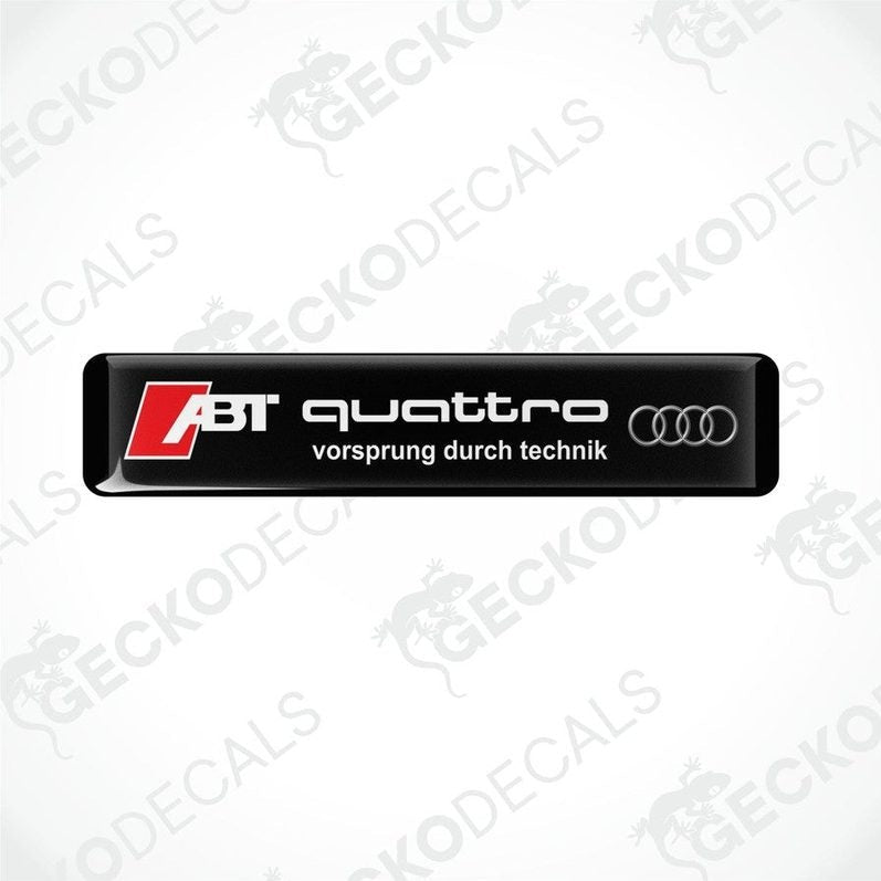 Black vinyl stickers with the text 'ABT QUATTRO' and the Audi logo, with the slogan 'VORSPRUNG DURCH TECHNIK'.