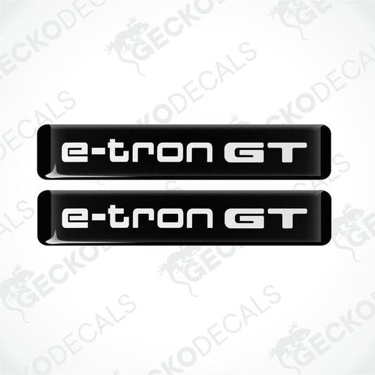 Two black decals with 'e-tron GT' written in white, designed for car use.
