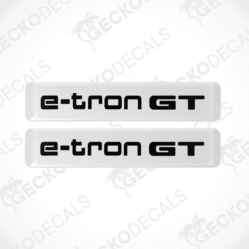 Two white decals with 'e-tron GT' written in black, designed for car use.