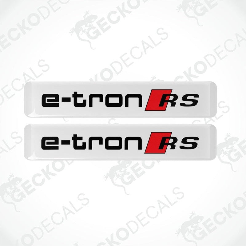Two white, red, and black vinyl decals with the text 'e-tron RS' on them, placed on a white background.
