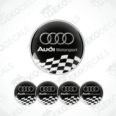 Set of four black and white vinyl decals with the Audi Motorsport logo and a checkered flag design.