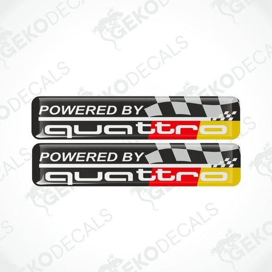 Two 'Powered by quattro' decals with a checkered pattern on a white background.
