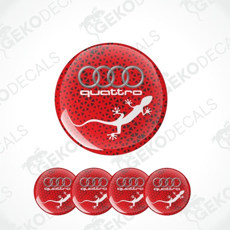 A set of four red vinyl stickers with the word 'QUATTRO' and an illustration of a white lizard on a black background, with the Audi logo above.