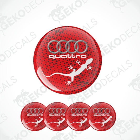 A set of four red vinyl stickers with the word 'QUATTRO' and an illustration of a white lizard on a black background, with the Audi logo above.