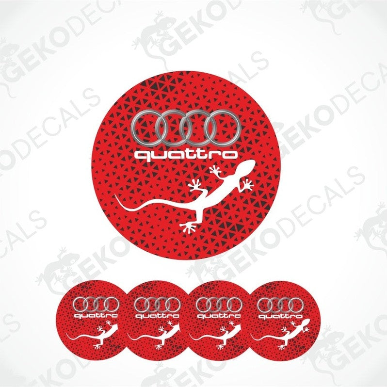 A set of four red vinyl stickers with the word 'QUATTRO' and an illustration of a white lizard on a black background, with the Audi logo above.
