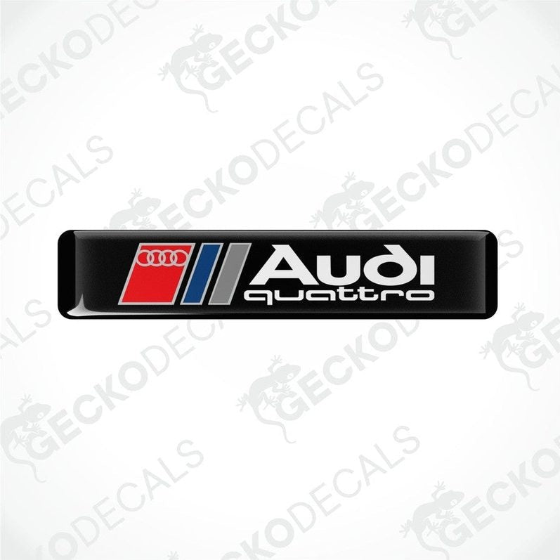 Audi Quattro branded vinyl decals with a black background and red and silver accents.