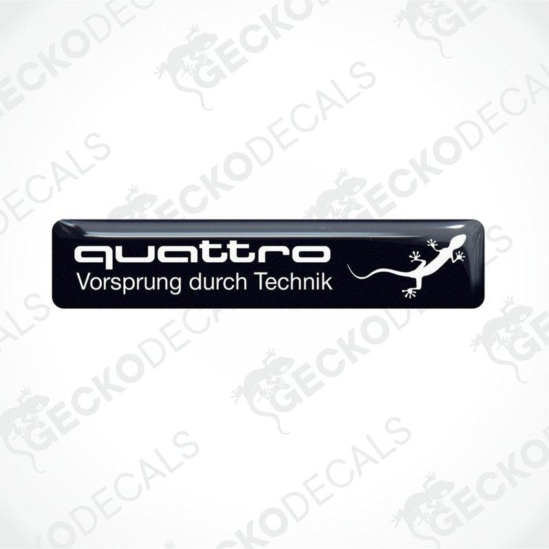 Black vinyl decals with 'quattro Vorsprung durch Technik' and a white Audi logo on a white background.