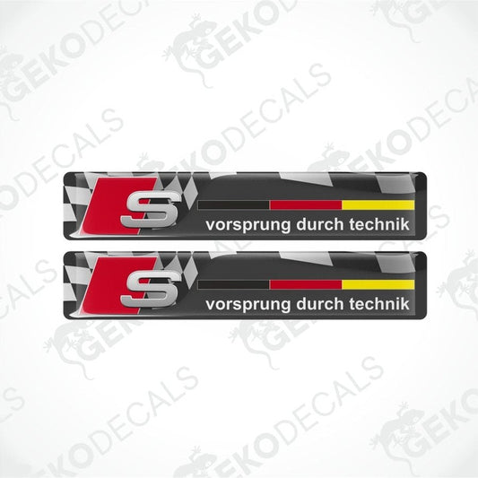 Two Audi decals with 'vorsprung durch technik' text on a white background.