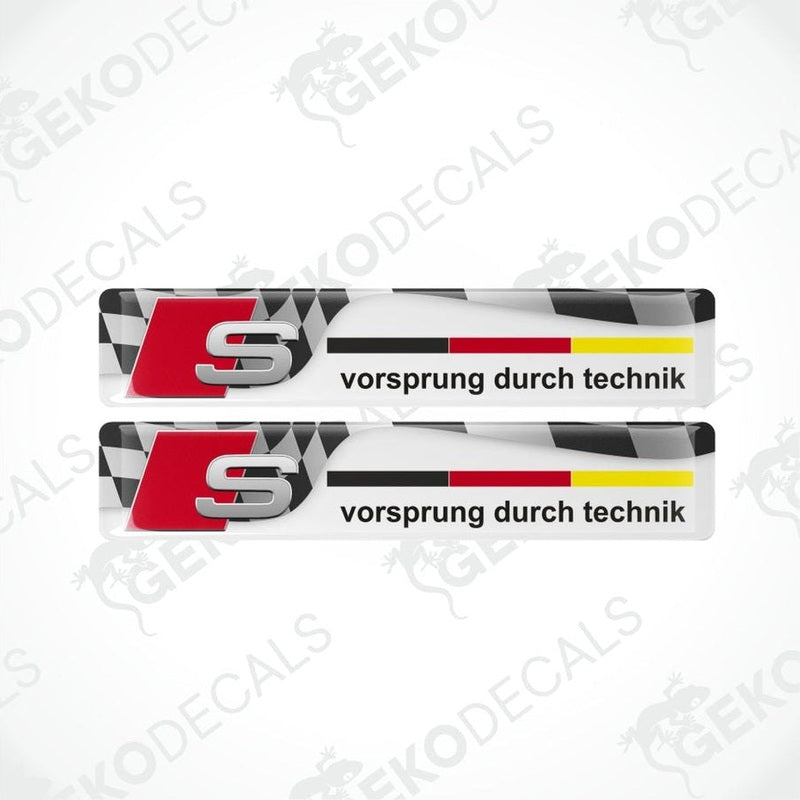 Two Audi S logo decal stickers with checkered pattern on a white background.