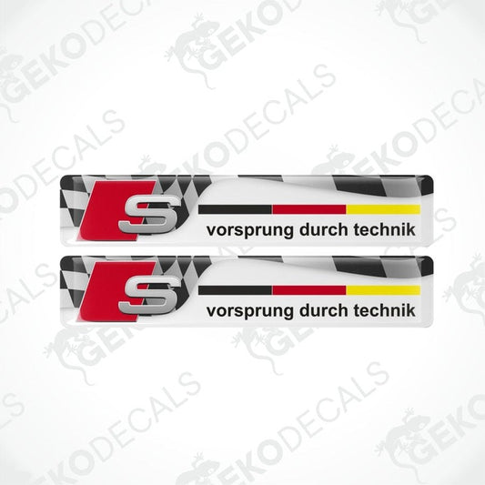 Two Audi S logo decal stickers with checkered pattern on a white background.