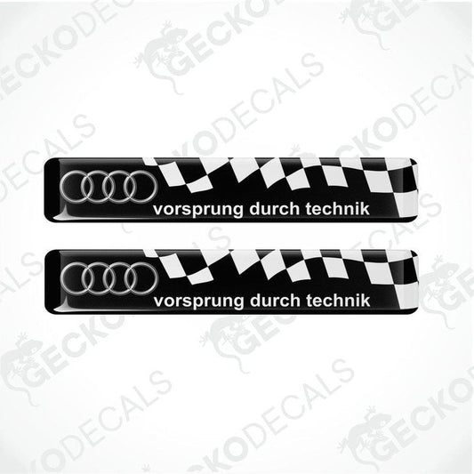 Two black and white vinyl decals with 'vorsprung durch technik' text and Audi logo