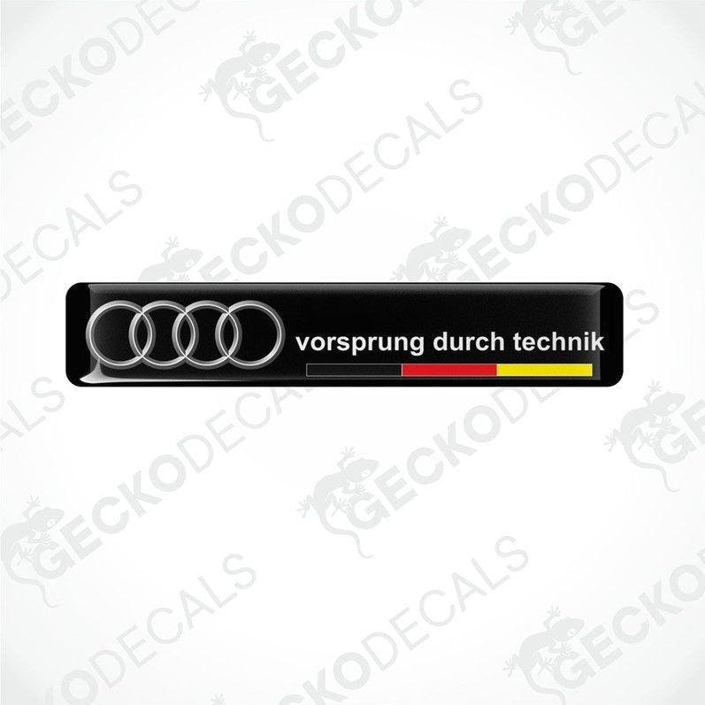Black vinyl decals with the text 'vorsprung durch technik' and the Audi logo in silver, arranged horizontally.