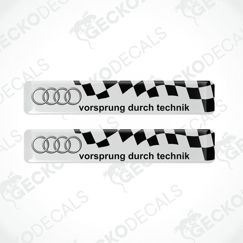 Two white and bvinyl decals with 'vorsprung durch technik' text and Audi logoack