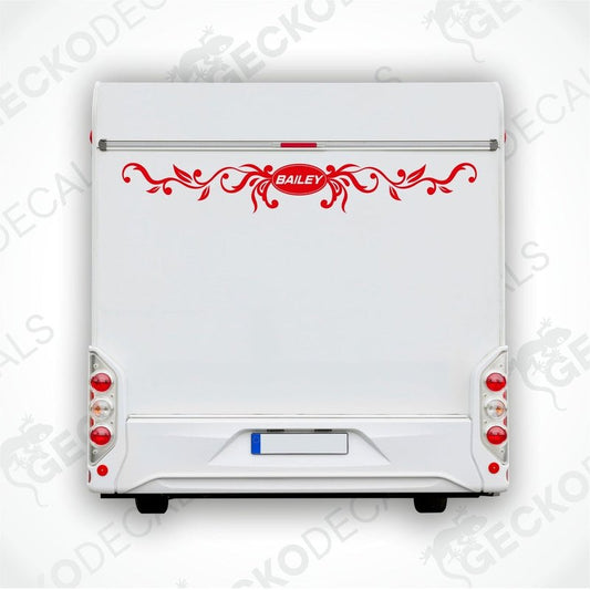 Red ornate scrollwork BAILEY caravan rear decal on white exterior