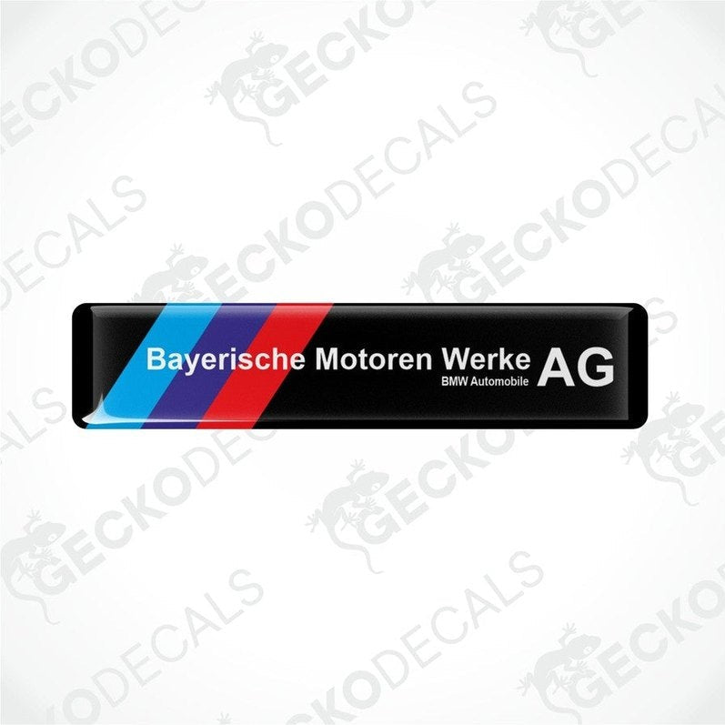  Rectangular car decals with a striped pattern in blue and red on a white background, and white text saying 'Bayerische Motoren Werke AG BMW Automobile AG'.
