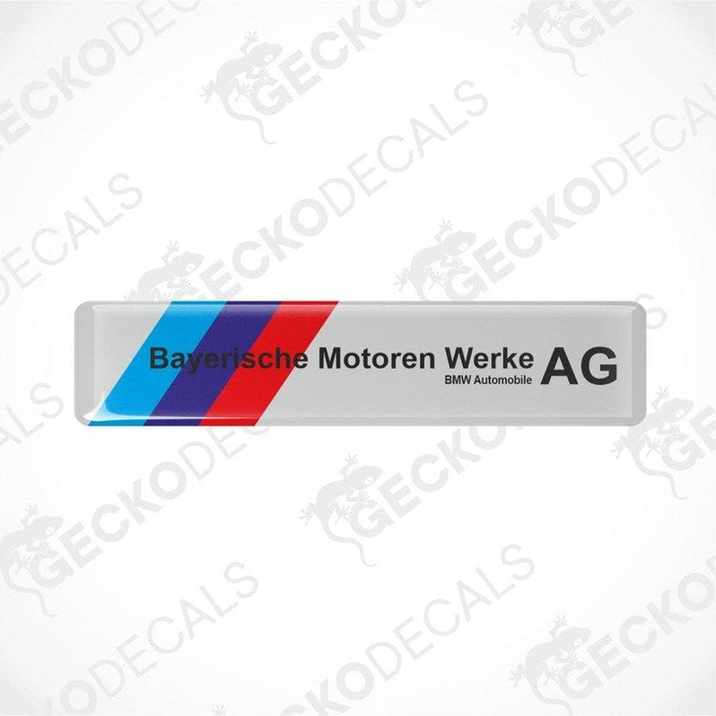  Rectangular car decals with a striped pattern in blue and red on a white background, and black text saying 'Bayerische Motoren Werke AG BMW Automobile AG'.
