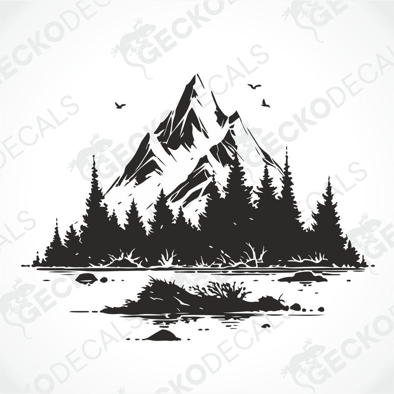 A die cut decal of a mountain scenery with trees and birds, intended for use on vehicles or other surfaces, displayed on a white background.