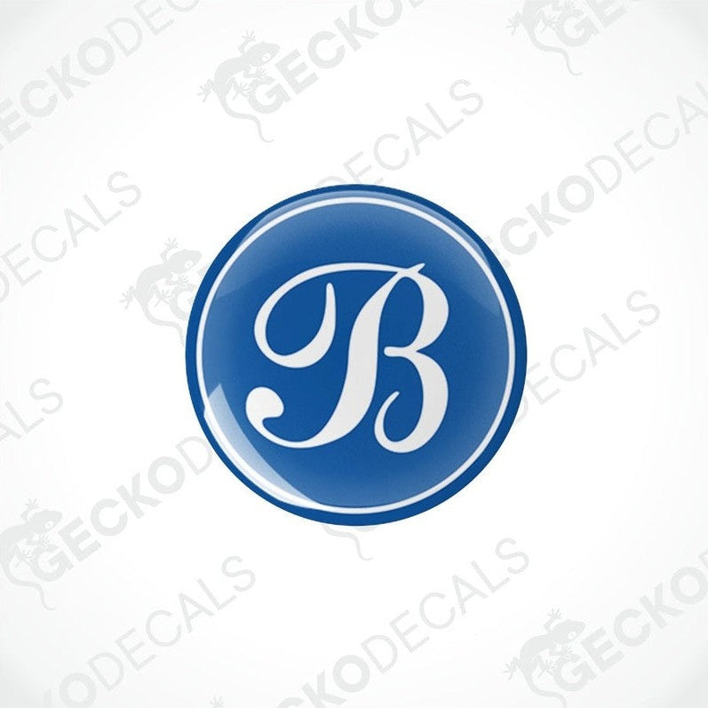 Single blue domed epoxy decal for caravans with white cursive B letter and glossy polyurethane finish
