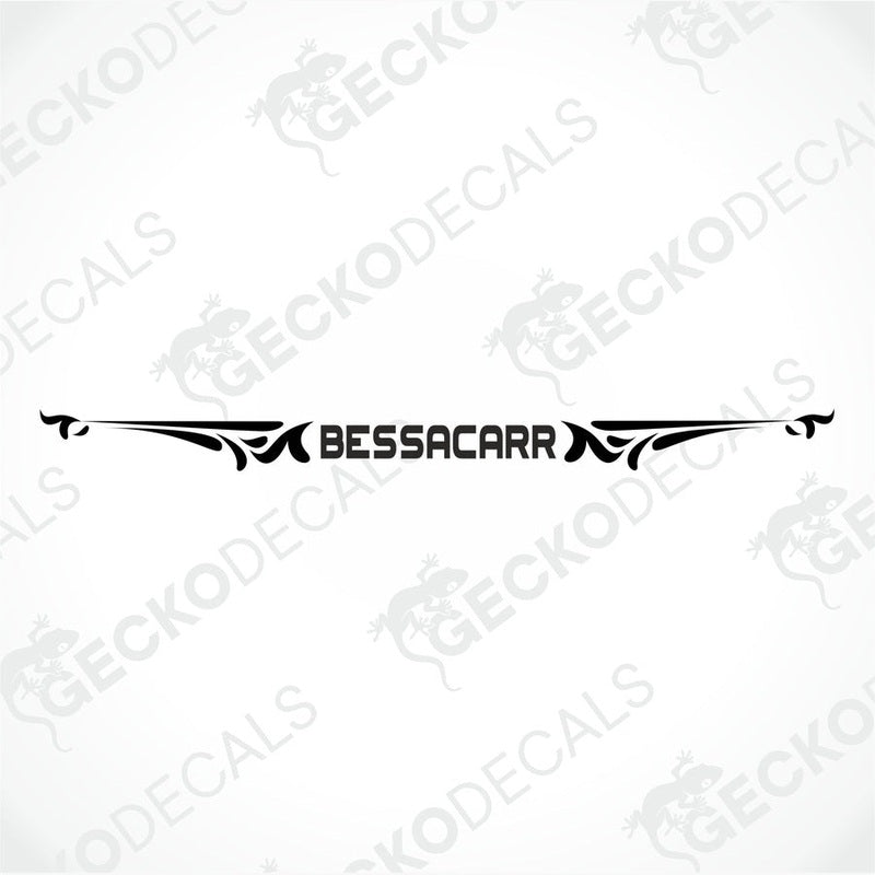 Black BESSACARR die-cut decorative sticker with symmetrical flourishes on transfer paper