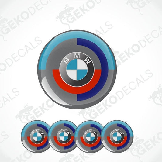 A set of four vinyl stickers with a BMW logo, featuring a gradient of blue, red, and white colors.