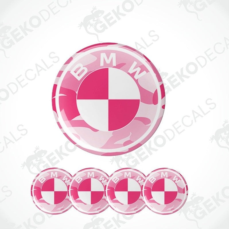 A set of four pink, white, and black vinyl stickers with a BMW logo design.