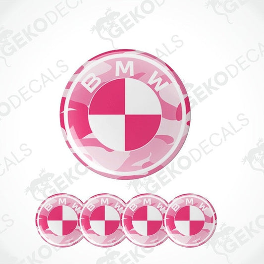 A set of four pink, white, and black vinyl stickers with a BMW logo design.