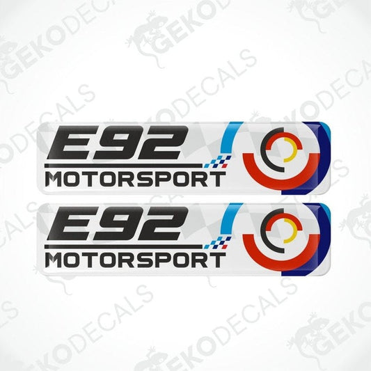 Two 'E92 Motorsport' decal stickers with a logo on a white background.