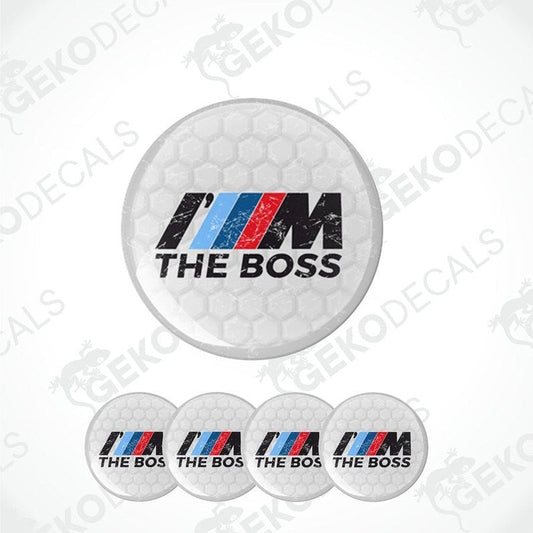 A set of four vinyl decals for a BMW vehicle, with the text 'THE BOSS' and the BMW logo in a white, red, and blue color scheme.