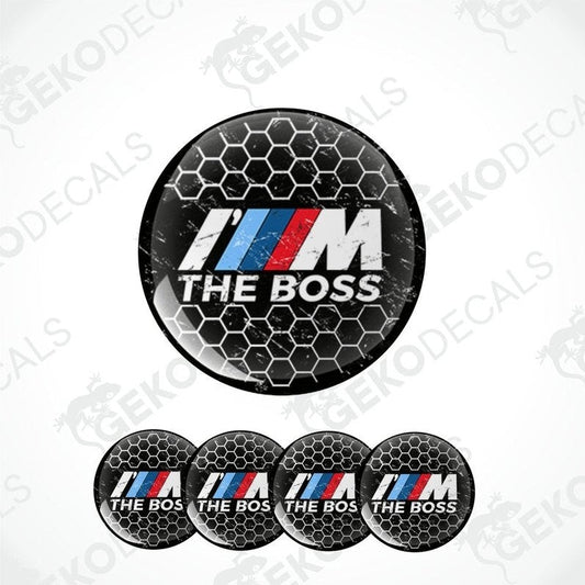 A set of four black vinyl stickers with the text 'I'M THE BOSS' and the BMW logo in the center, arranged on a white background.