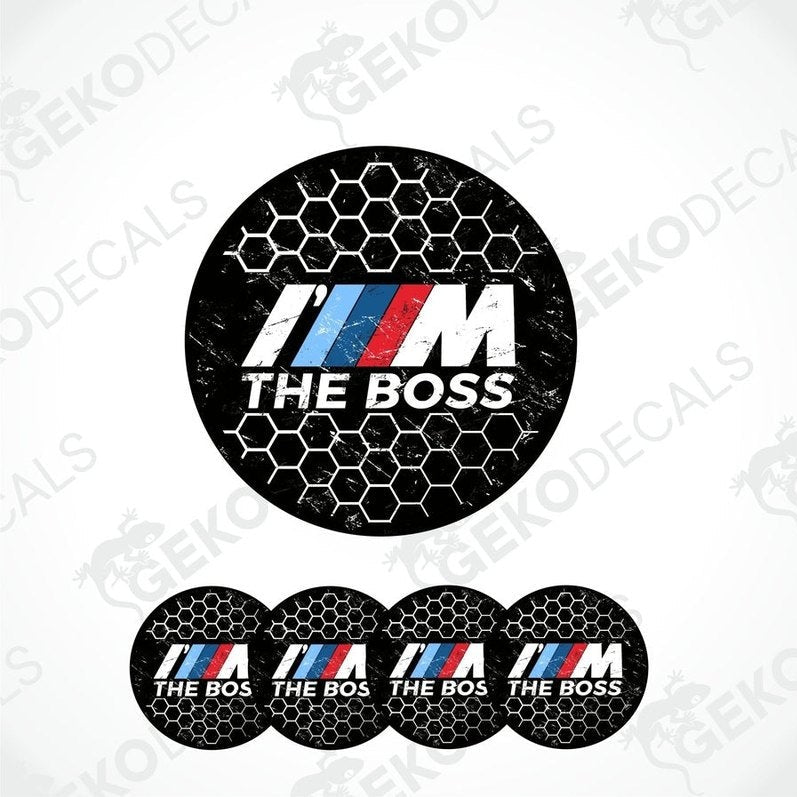 A set of four black vinyl stickers with the text 'I'M THE BOSS' and the BMW logo in the center, arranged on a white background.