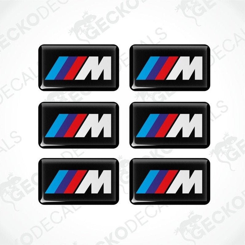 Set of six BMW M  vinyl stickers with polyurethane coating featuring the M Performance logo in white, red and blue on a black background.