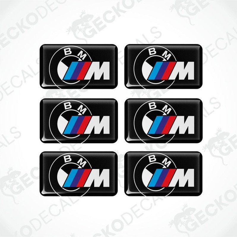 Set of six BMW M  vinyl stickers with polyurethane coating featuring the M Performance logo in white, red and blue on a black background.