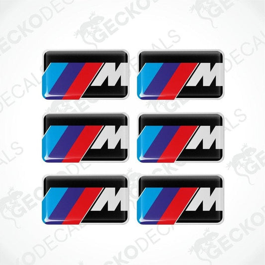 A set of six BMW M branded vinyl stickers with a polyurethane coating, displayed on a white background.