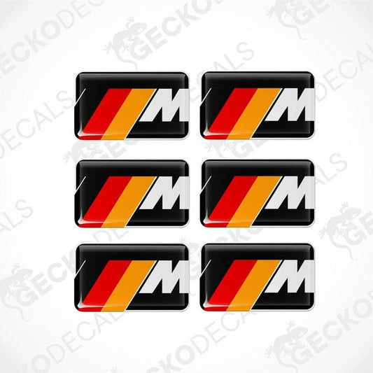 Set of six white BMW M branded polyurethane-coated vinyl stickers on a black background.