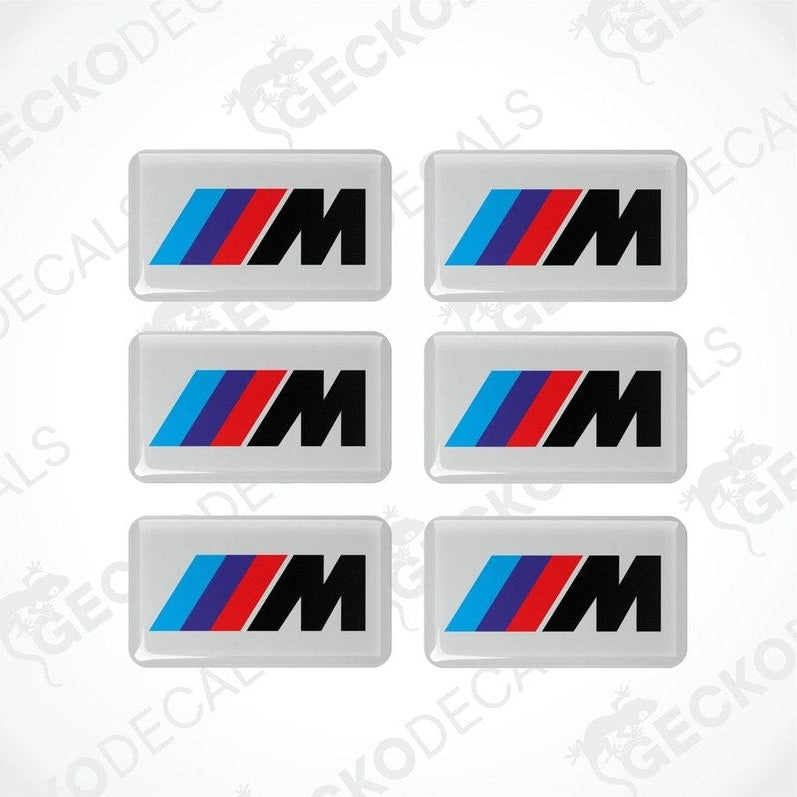 Set of six BMW M  vinyl stickers with polyurethane coating featuring the M Performance logo in black, red and blue on a white background.