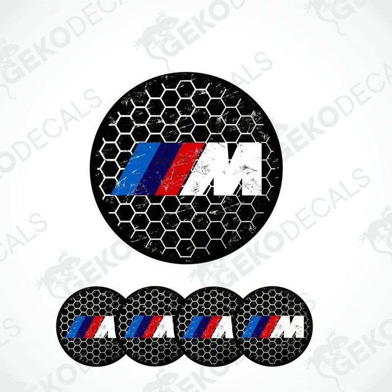 A set of four vinyl decals with polyurethane coating featuring the BMW M logo in black, red, and blue on a honeycomb pattern background.