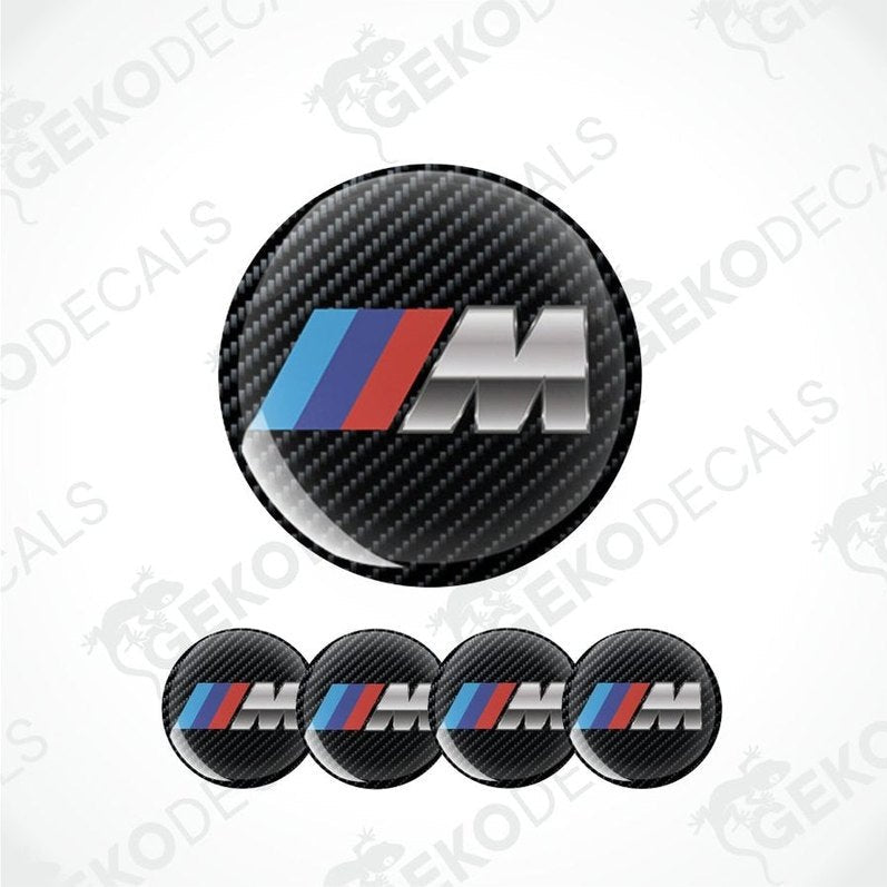 BMW M logo decal with carbon fiber texture on a white background