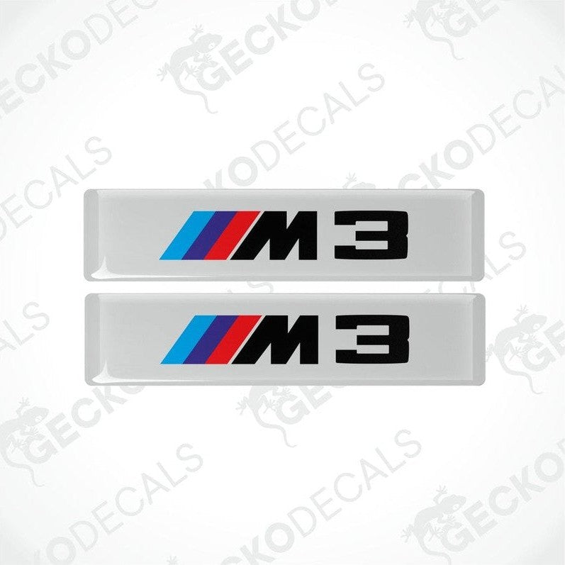 Two stickers with BMW M3 logos in light blue, blue and red on a white background
