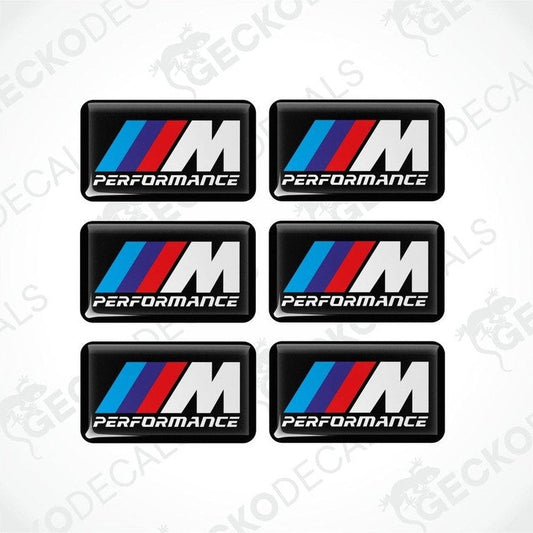 Set of six BMW M Performance vinyl stickers with polyurethane coating featuring the M Performance logo in white, red and blue on a black background.