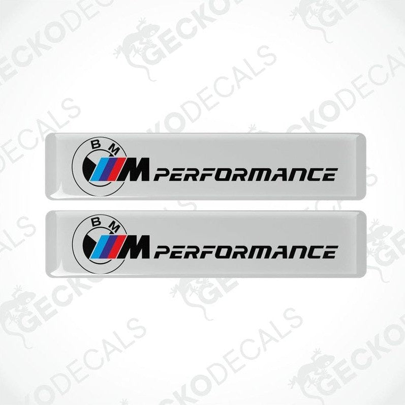 Two white vinyl stickers with the BMW M PERFORMANCE logo and the Gecko Decals logo.