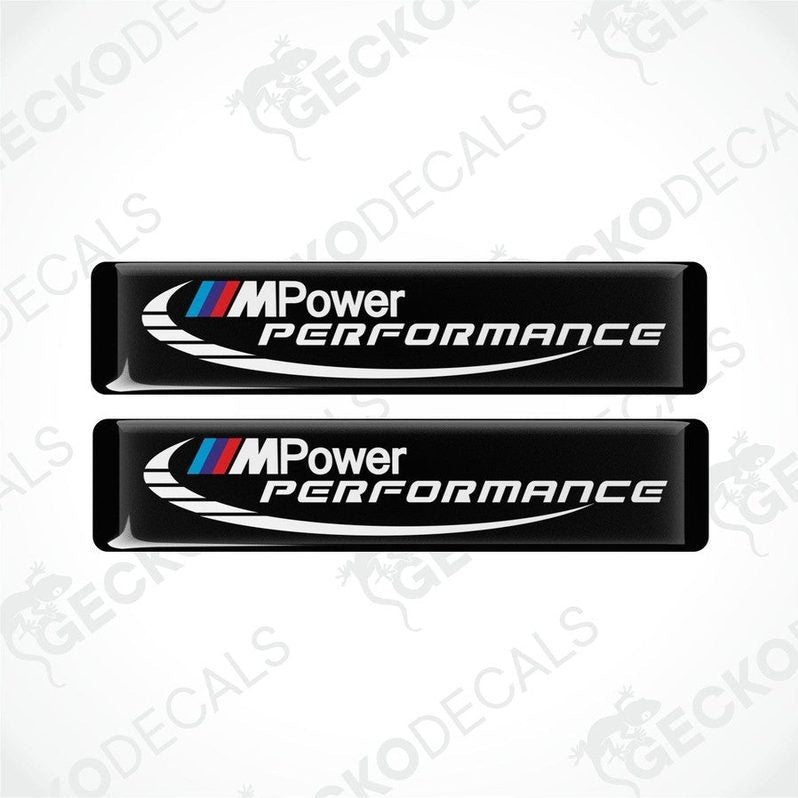 Two black decals with 'M Power Performance' text and the BMW logo in white and blue