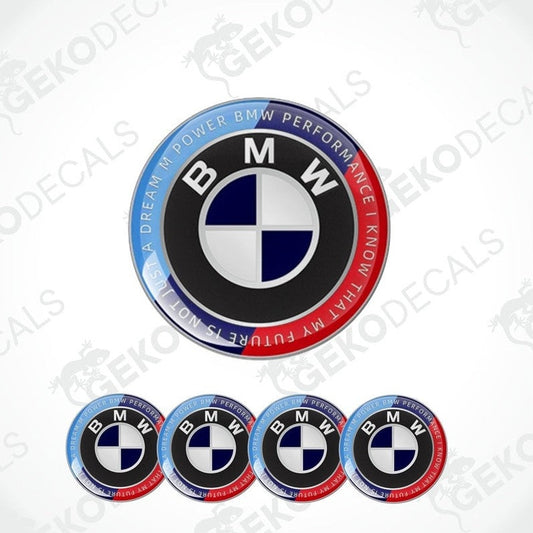 A set of round BMW M POWER PERFORMANCE vinyl decals with a central emblem and blue and red accents around the text.