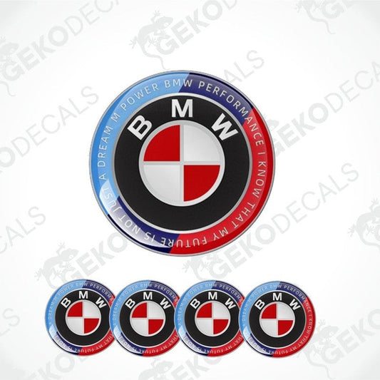 A set of round BMW M POWER PERFORMANCE vinyl decals with a red, white, and blue color scheme and the BMW logo prominently displayed.