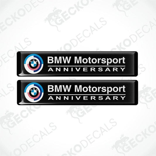 Set of four BMW Motorsport Anniversary vinyl decals with a black background and white text, featuring the BMW logo.