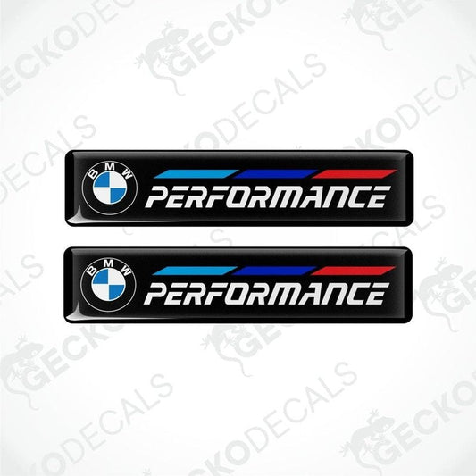 Set of four BMW Performance vinyl decals with blue and red stripes on a black background.