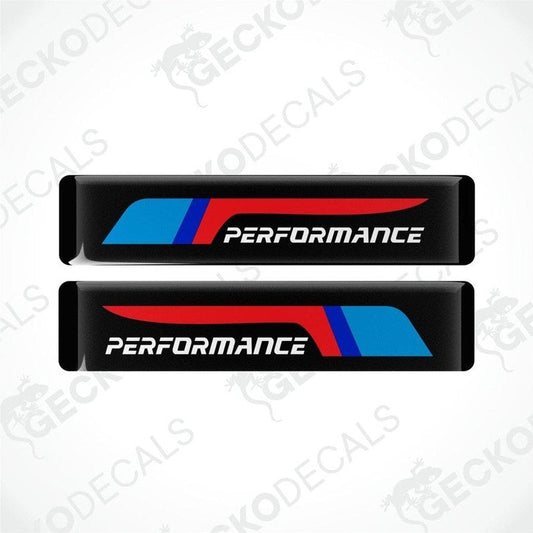 Two black vinyl stickers with red and blue geometric patterns and the text 'PERFORMANCE' on a white background.