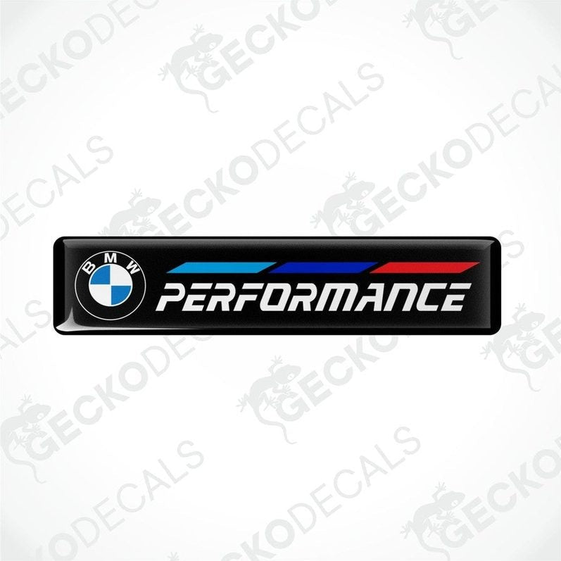 BMW Performance vinyl decals with blue and red stripes on a black background.